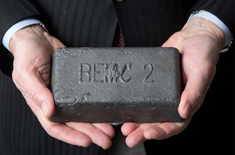 holding-metal-brick