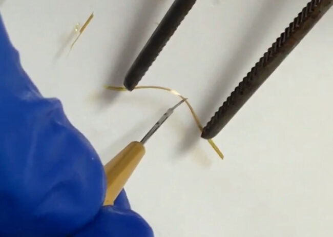 Still – yellow crystal being bent