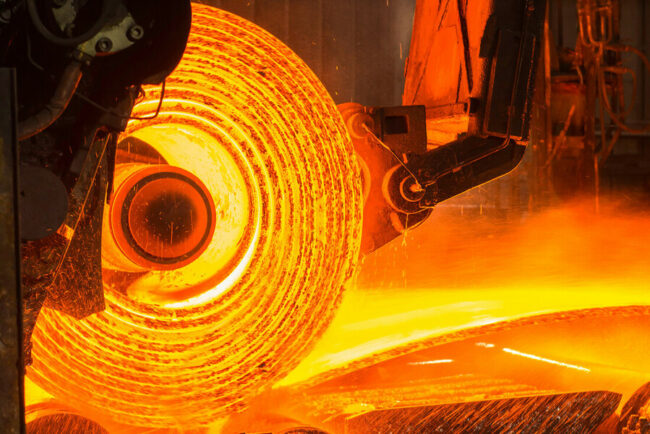 A roll of hot metal on the conveyor belt
